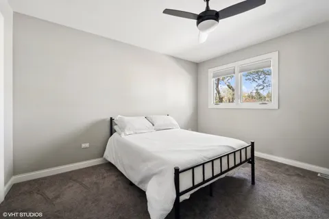 a bathroom with a sink mirror and vanity