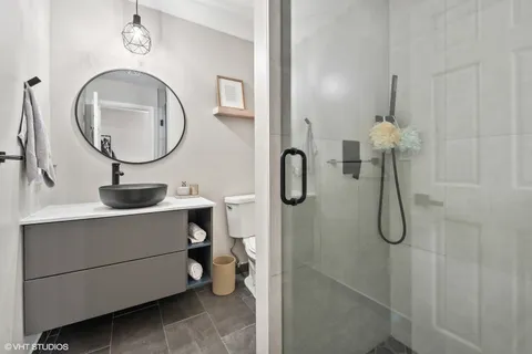 a view of a living room with furniture and a potted plant