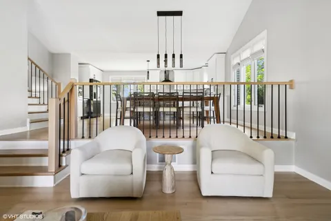 a bedroom with furniture and a chandelier