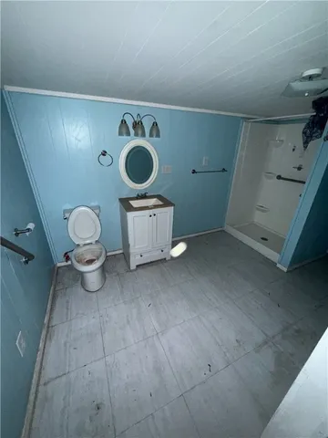 a view of a storage & utility room with a washing machine