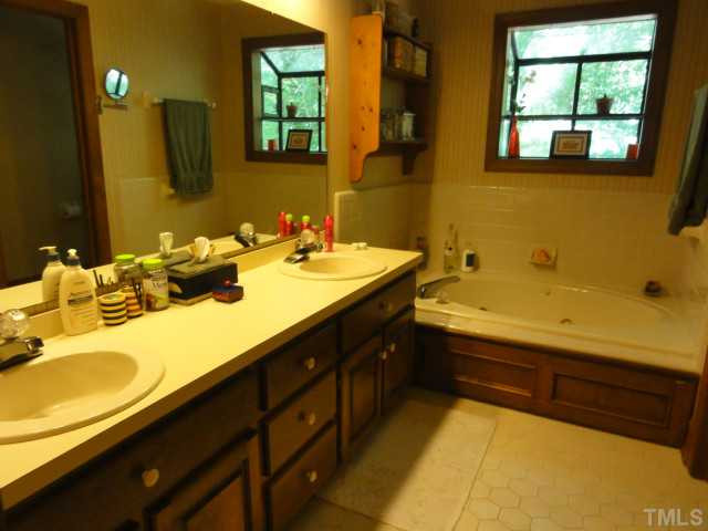 1500 Sharnbrook Court Raleigh, NC 27614 - Photo 22 of 24 Dual vanities, whirlpool tub with plant window above, separate shower and Private w/c! Master Bath/Spa