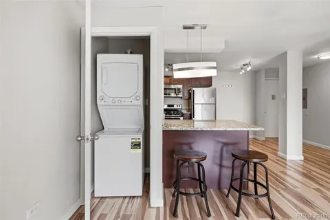 a kitchen with a table and chairs in it