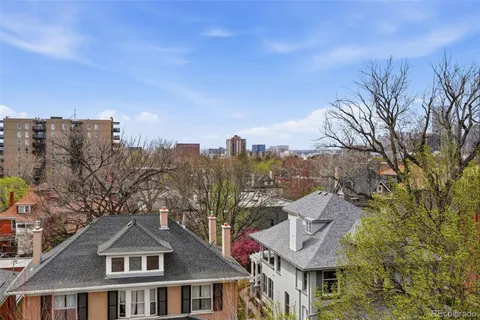 a view of a city with a building in the background