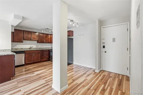 a view of kitchen with wooden floor
