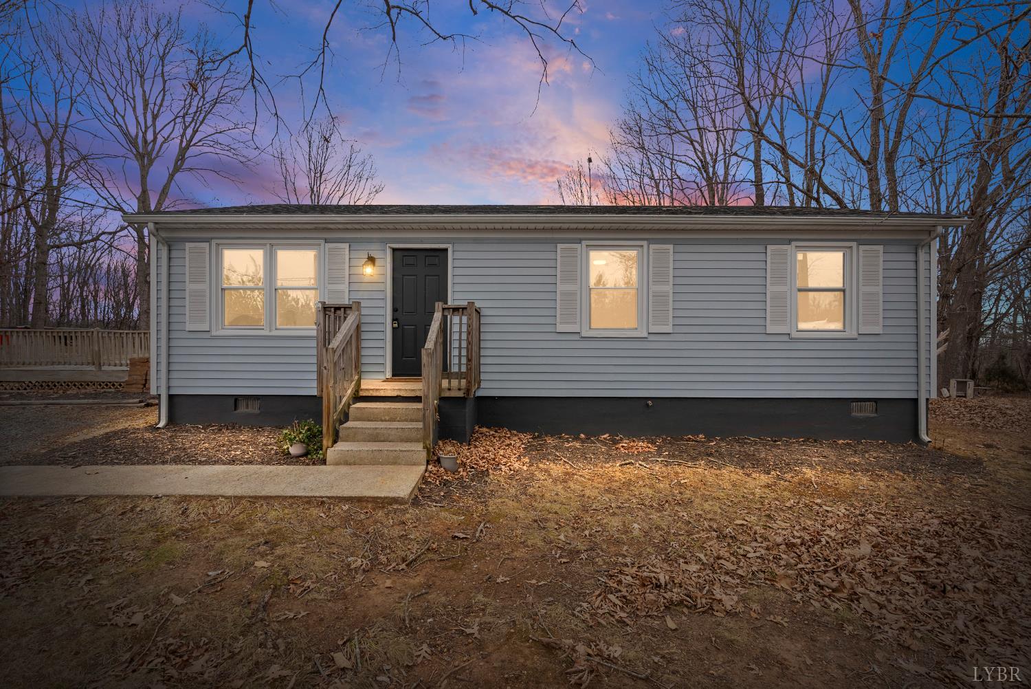 2622 Bethany Road Rustburg, VA 24588 - Photo 1 of 28 a front view of a house with a yard and garage