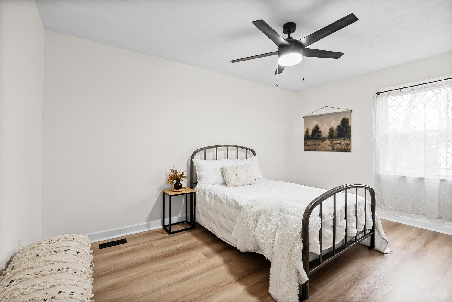 2622 Bethany Road Rustburg, VA 24588 - Photo 11 of 28 a bedroom with a bed and a window