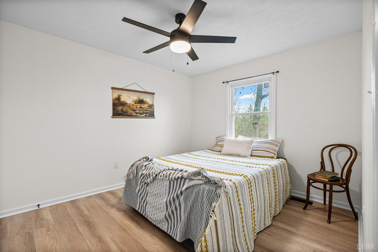 2622 Bethany Road Rustburg, VA 24588 - Photo 14 of 28 a bedroom with a bed and a table