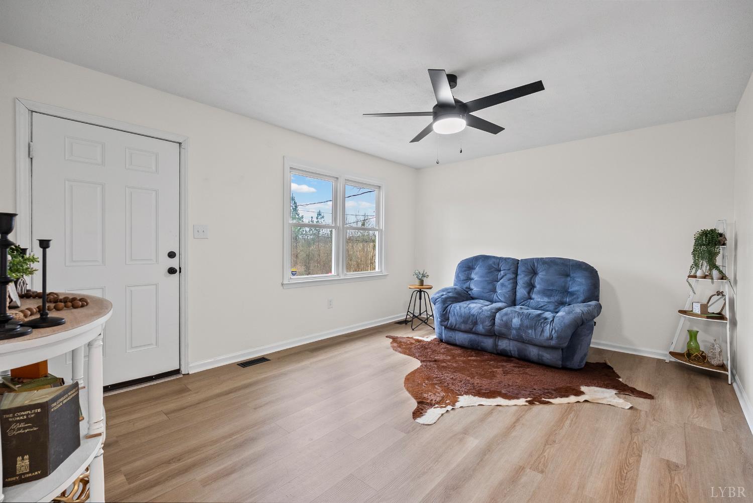 2622 Bethany Road Rustburg, VA 24588 - Photo 3 of 28 a living room with furniture window and wooden floor