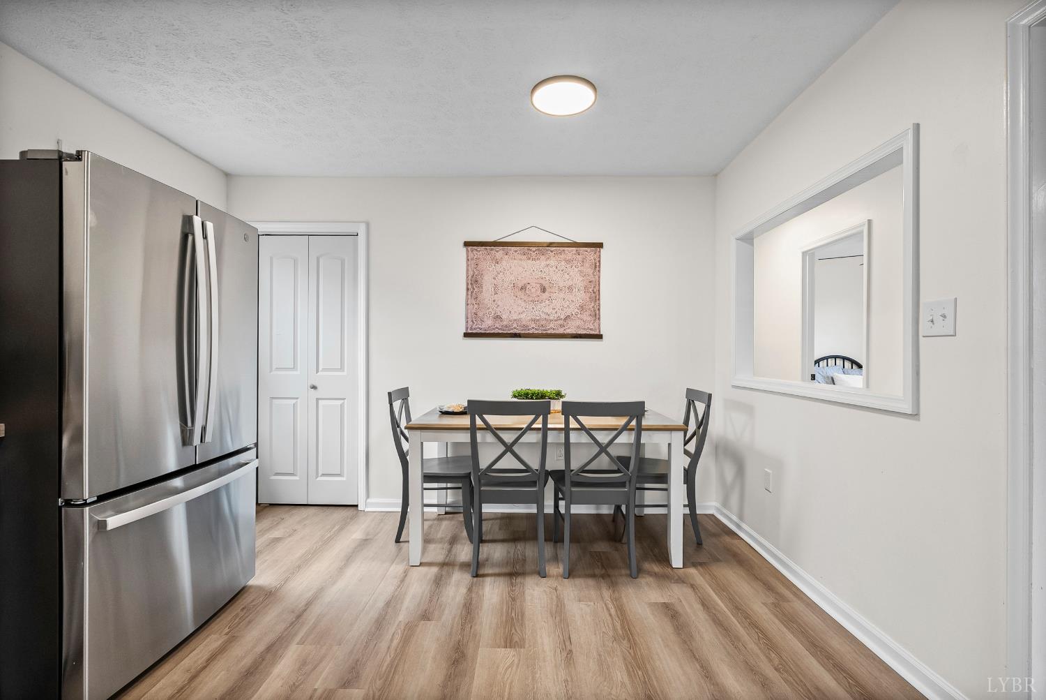 2622 Bethany Road Rustburg, VA 24588 - Photo 6 of 28 a view of a dining room with furniture and wooden floor