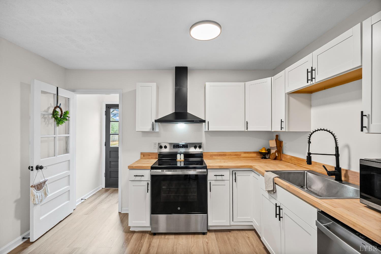 2622 Bethany Road Rustburg, VA 24588 - Photo 8 of 28 a kitchen with stainless steel appliances granite countertop a sink stove and refrigerator