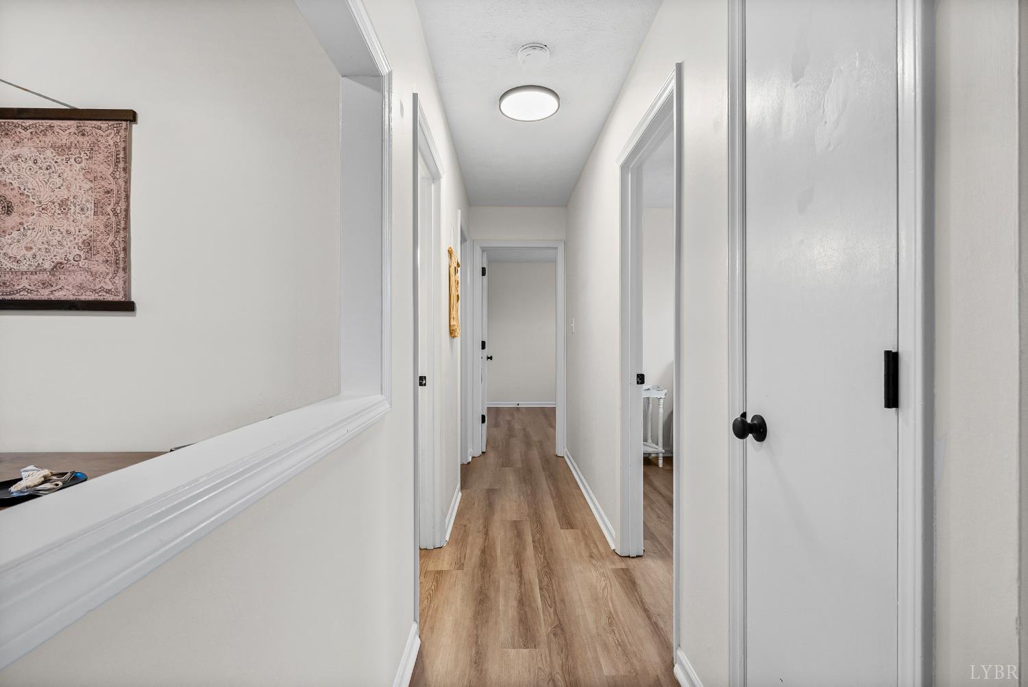 2622 Bethany Road Rustburg, VA 24588 - Photo 10 of 28 a view of a hallway with wooden floor