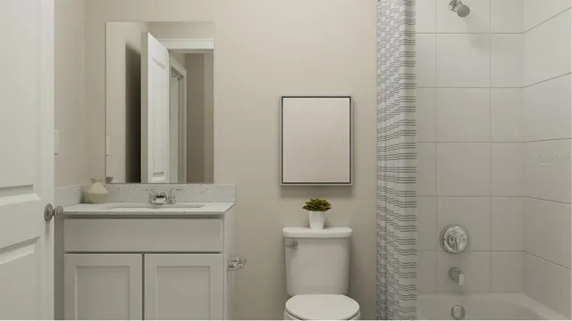 a bathroom with a sink toilet and mirror