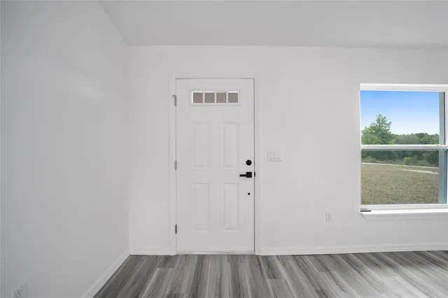 a view of an empty room and window