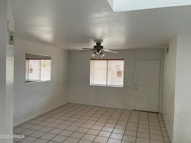 a view of an empty room and window