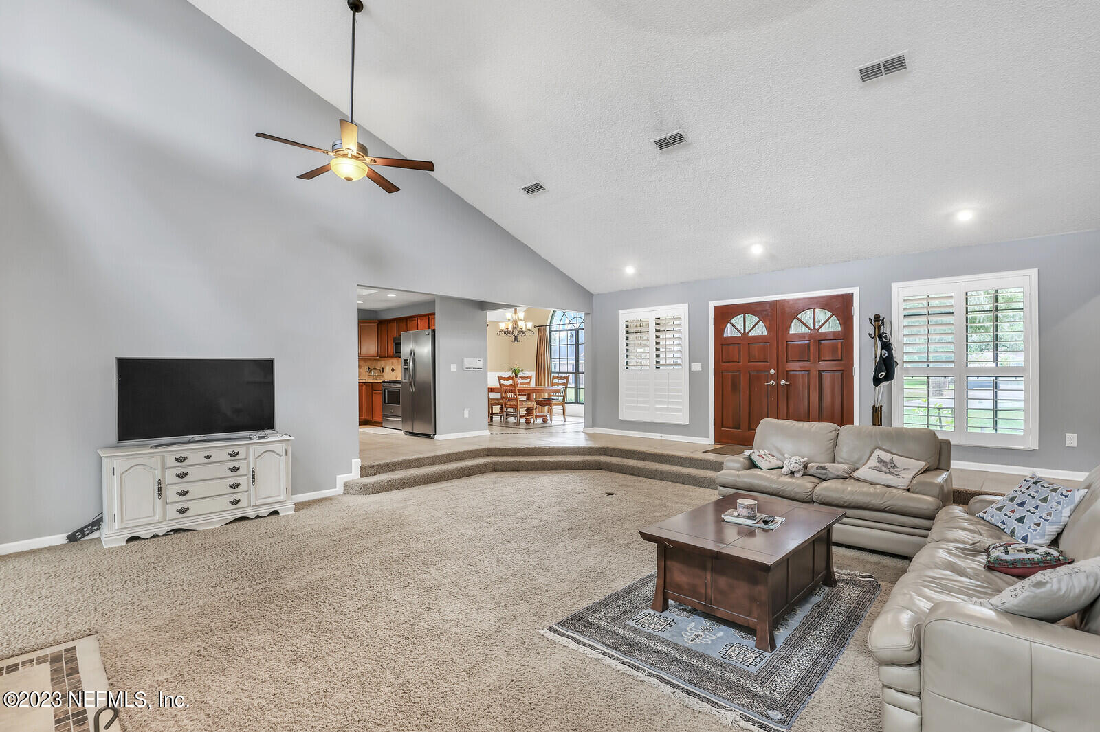 3001 Nautilus Road Middleburg, FL 32068 - Photo 11 of 26 a living room with furniture and a flat screen tv