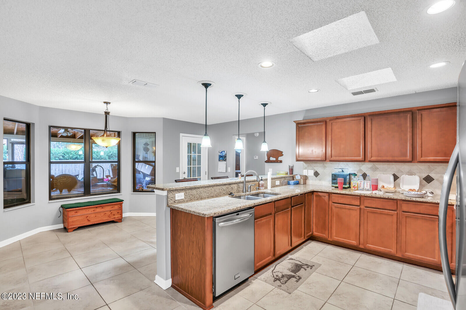 3001 Nautilus Road Middleburg, FL 32068 - Photo 13 of 26 a kitchen with a sink stove and cabinets