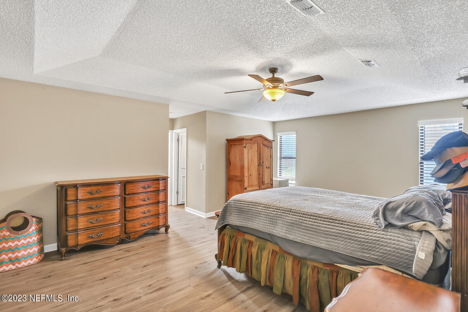 3001 Nautilus Road Middleburg, FL 32068 - Photo 20 of 26 a bedroom with a bed and a chandelier