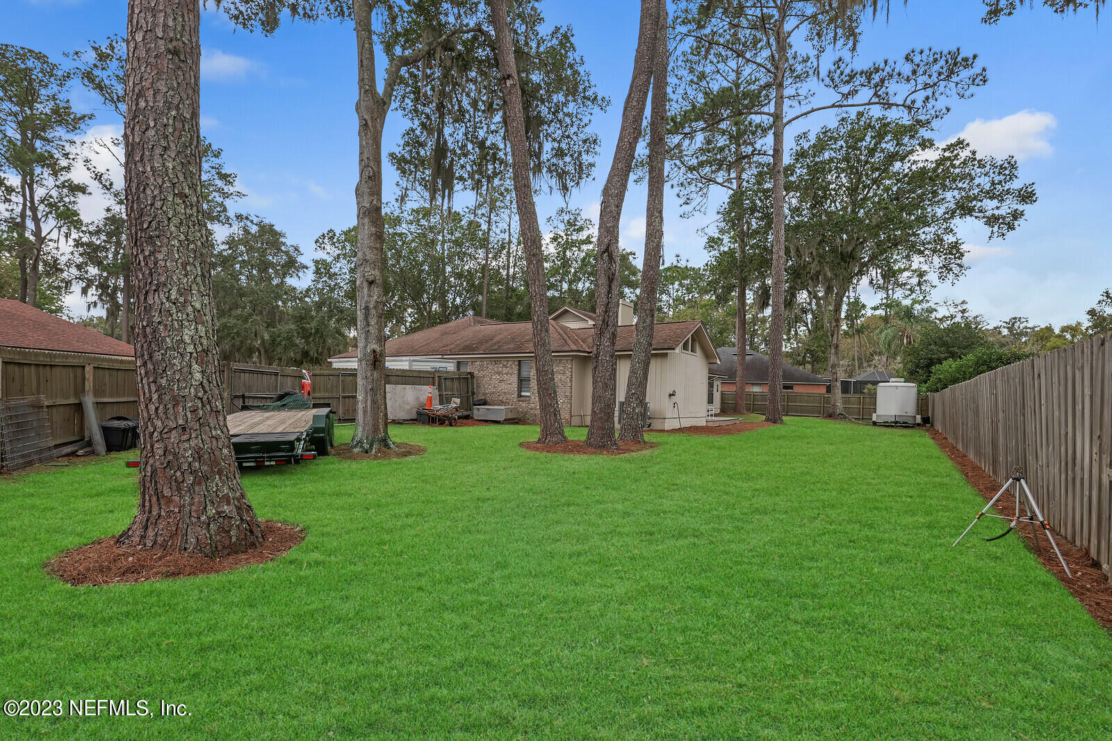 3001 Nautilus Road Middleburg, FL 32068 - Photo 2 of 26 a view of a house with backyard and a tree