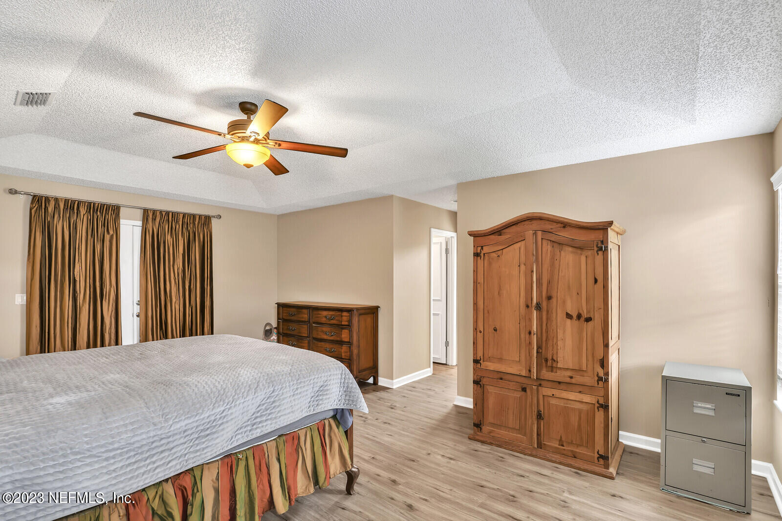 3001 Nautilus Road Middleburg, FL 32068 - Photo 21 of 26 a bedroom with a bed and wooden floor