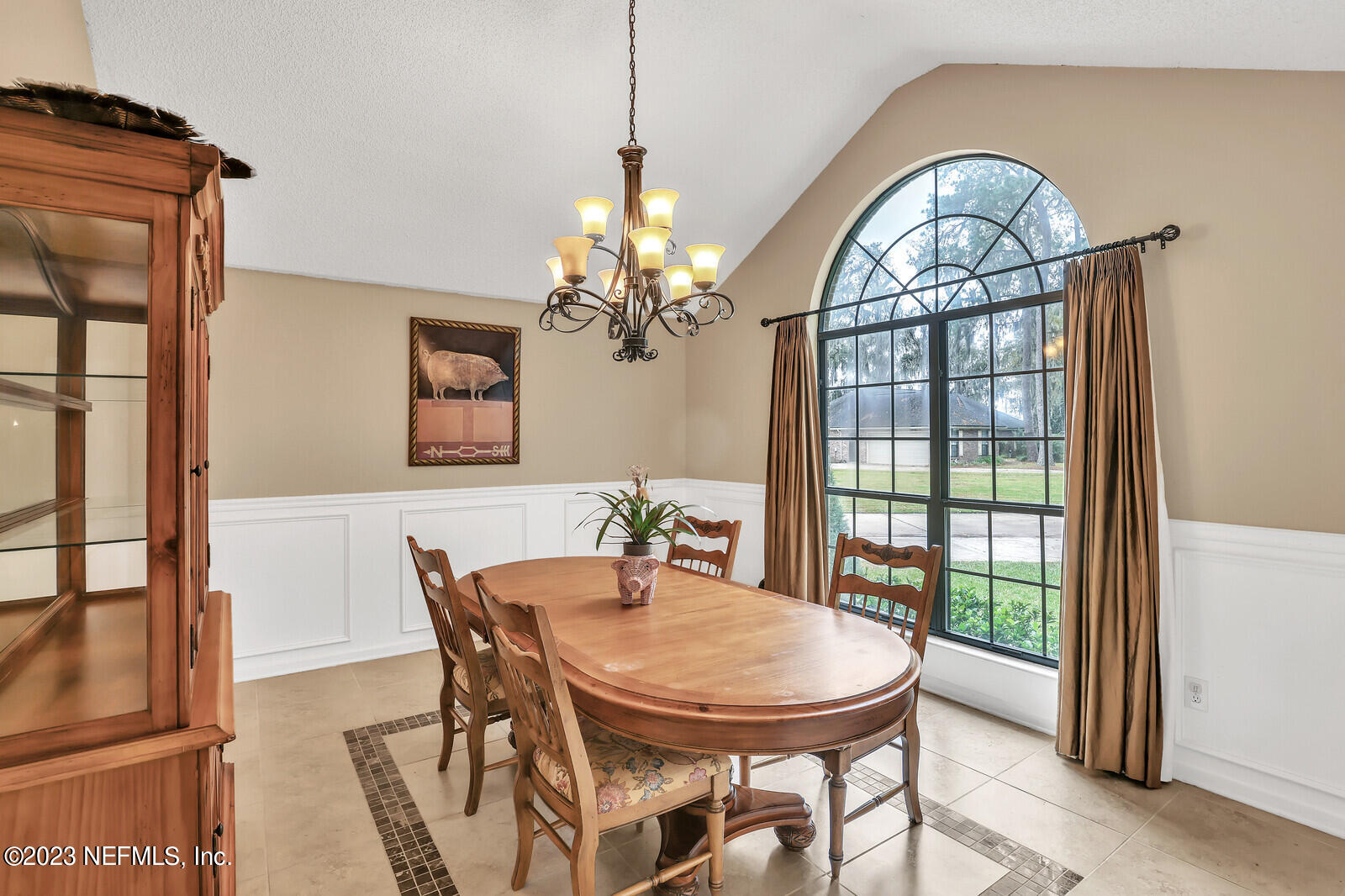 3001 Nautilus Road Middleburg, FL 32068 - Photo 9 of 26 a view of a dining room with furniture a chandelier and a window