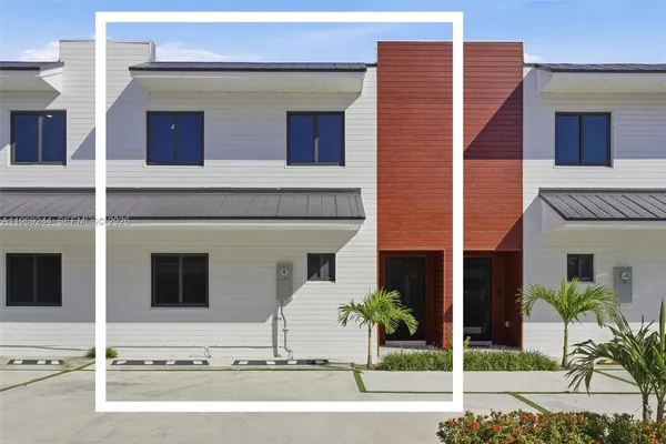 a black and white building with a outdoor space