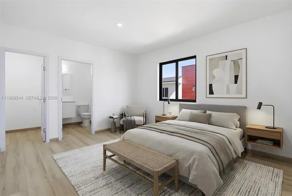 a bedroom with a bed and a couch