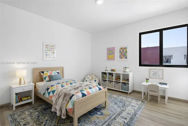 a bedroom with a bed and dresser