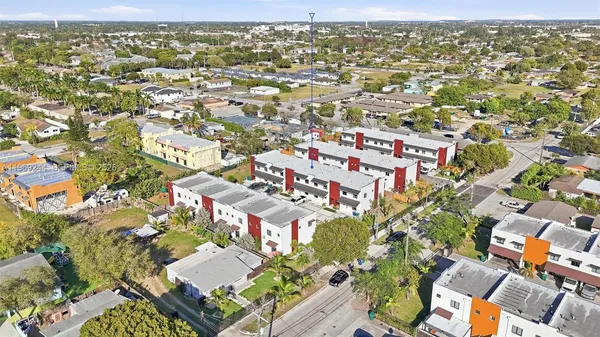 an aerial view of residential houses with outdoor space