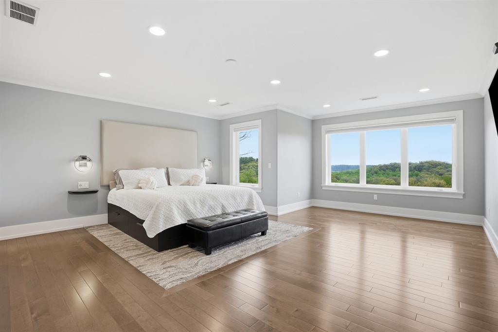 931 Pleasant Hill Road Wexford, PA 15090 - Photo 20 of 50 a spacious bedroom with a large bed and a large window