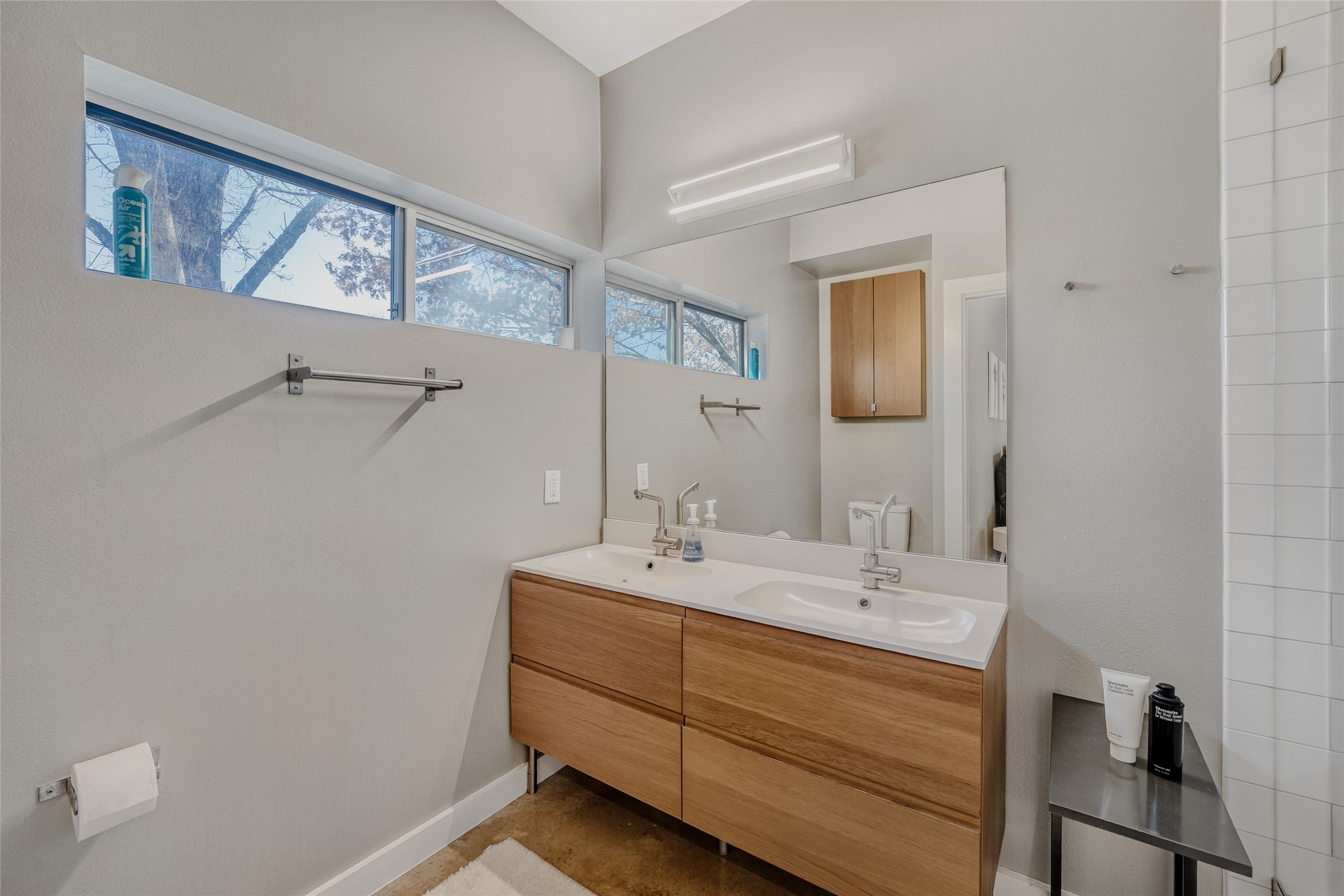 5909 Lux Street Austin, TX 78721 - Photo 17 of 28 Full bath with double vanity and great lighting