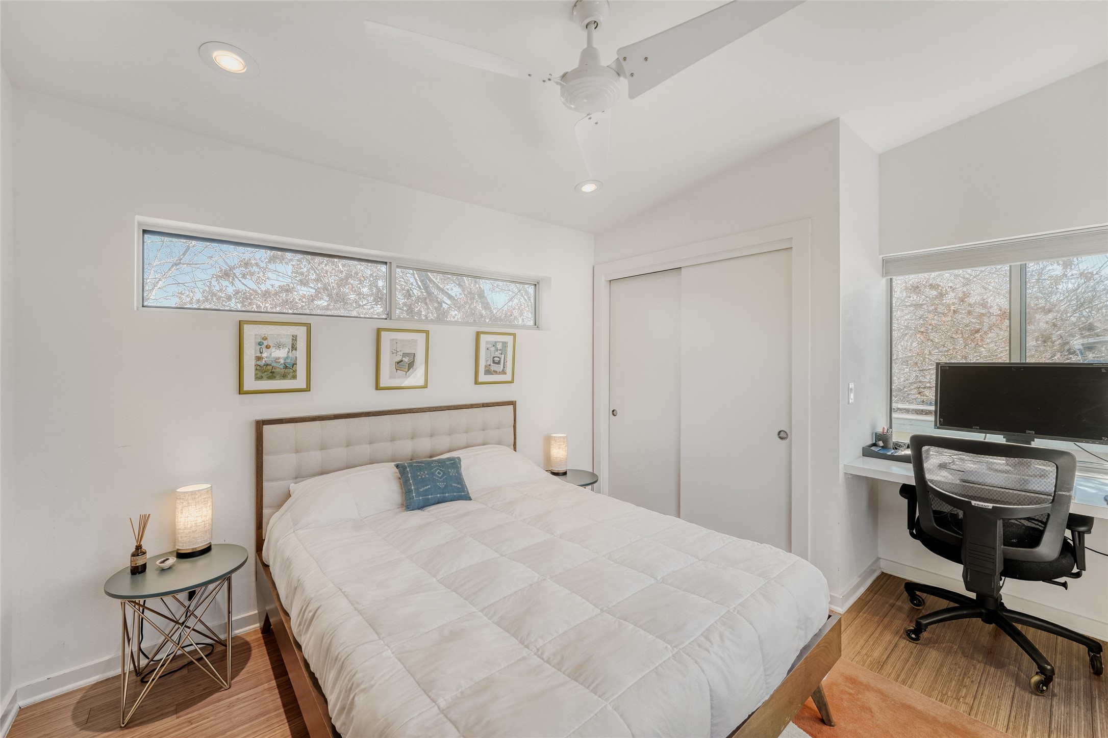 5909 Lux Street Austin, TX 78721 - Photo 19 of 28 Bedroom #2 featuring wood finished floors, recessed lighting, a ceiling fan, a closet, and an office area