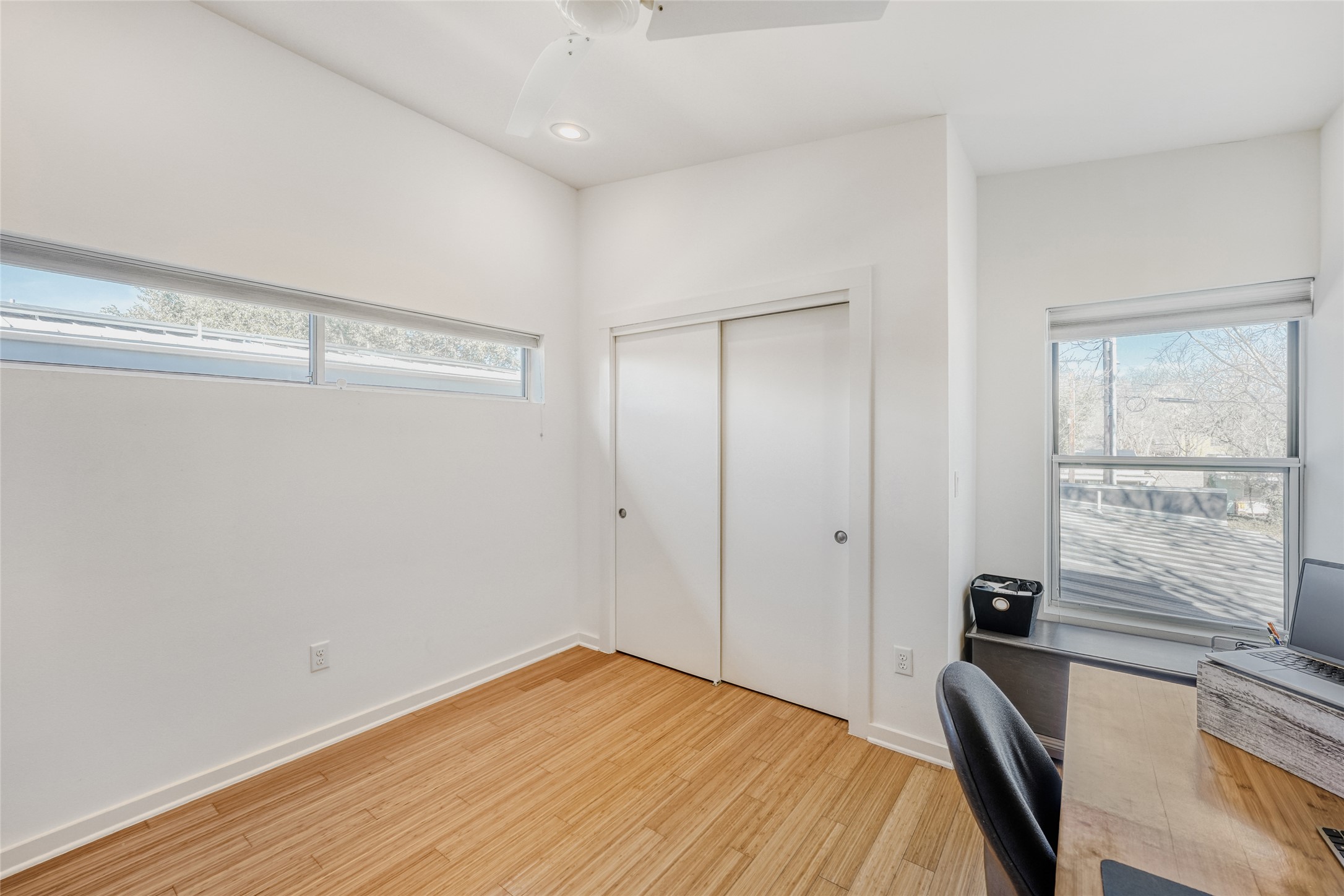 5909 Lux Street Austin, TX 78721 - Photo 22 of 28 Bedroom #3 with a ceiling fan, light wood-type flooring, plenty of natural light, and recessed lighting