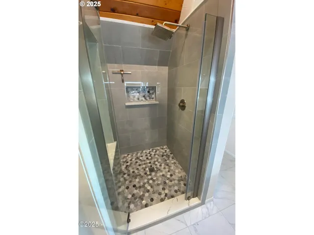 a bathroom with a small shower