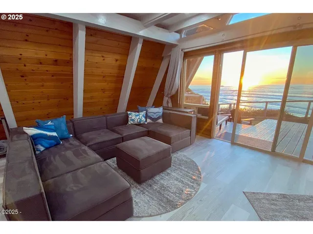 view of living room with furniture and floor to ceiling window
