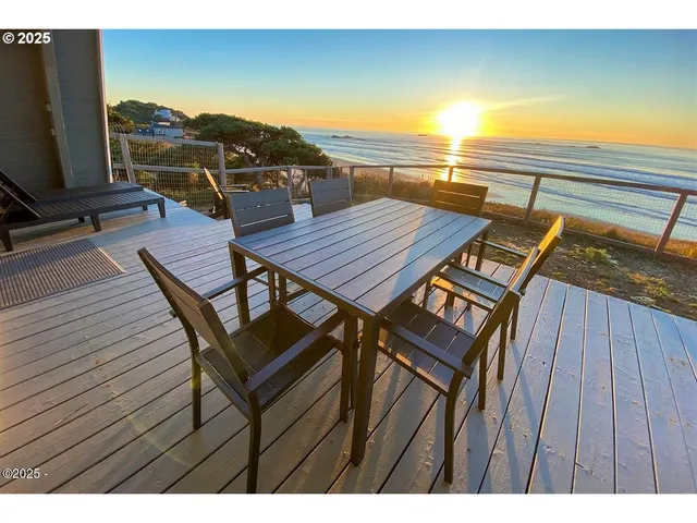 a view of a balcony with furniture and wooden floor