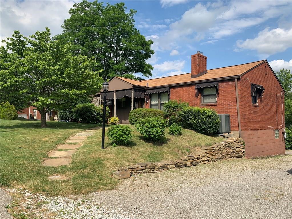 4227 Greenridge Road Pittsburgh, PA 15234 - Photo 1 of 23 Brick ranch on corner lot with spacious yard. Gravel driveway and integrated rear-entry garage.