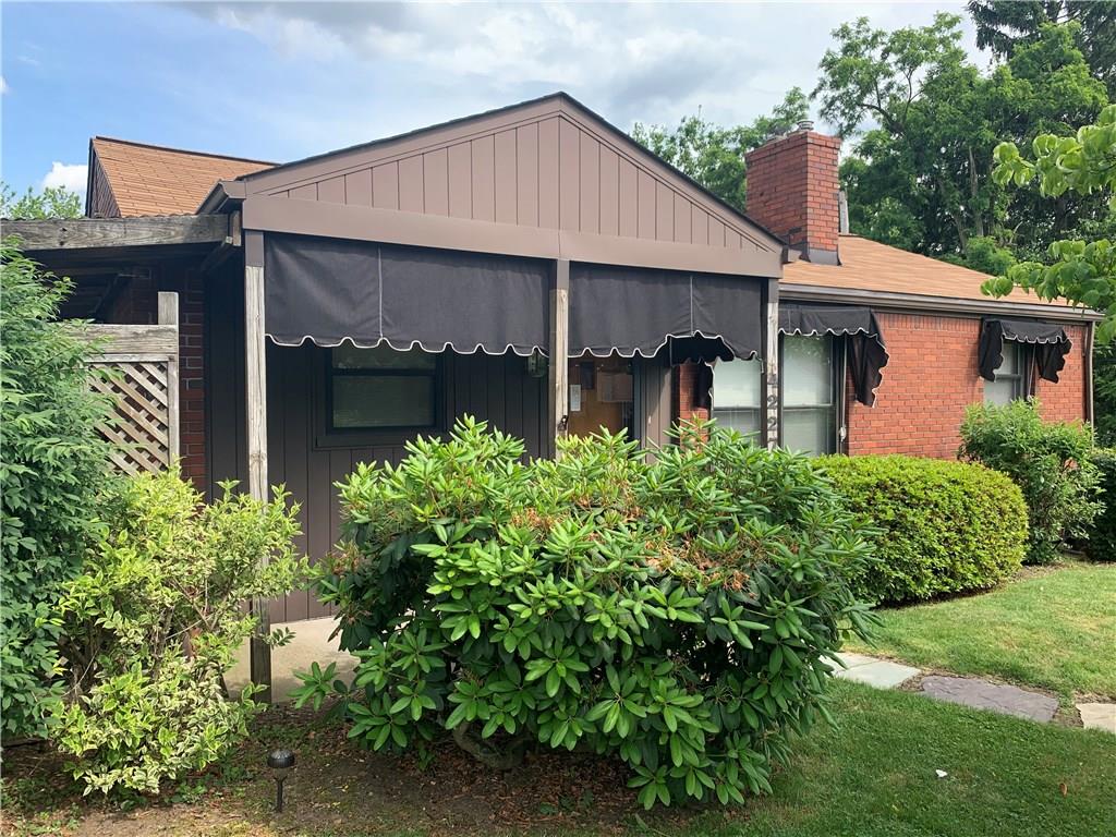 4227 Greenridge Road Pittsburgh, PA 15234 - Photo 21 of 23 Brick home with Window awnings.