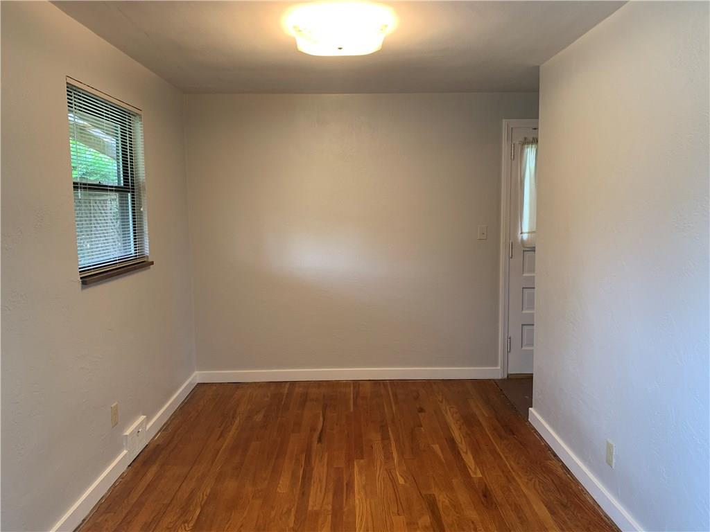 4227 Greenridge Road Pittsburgh, PA 15234 - Photo 5 of 23 Living room with gas fireplace and built-in bookshelves. Polished hardwood floors throughout.