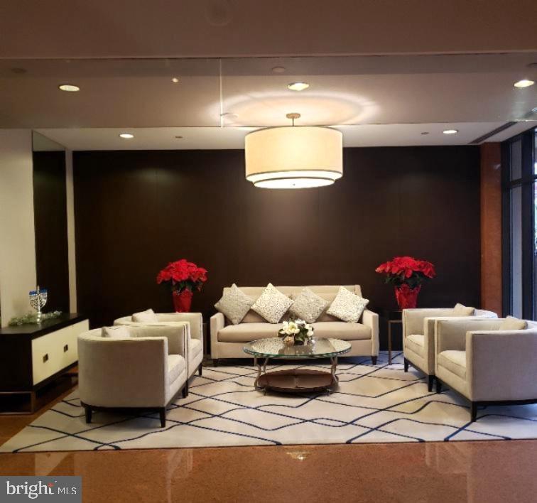 1530 Key Boulevard, Unit 1319 Arlington, VA 22209 - Photo 30 of 30 a living room with furniture and a chandelier