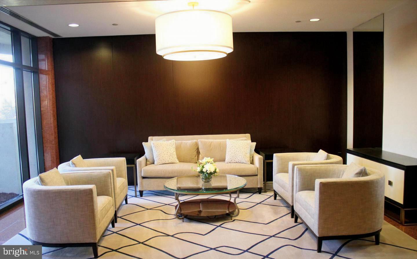 1530 Key Boulevard, Unit 1319 Arlington, VA 22209 - Photo 5 of 30 a living room with furniture and a window