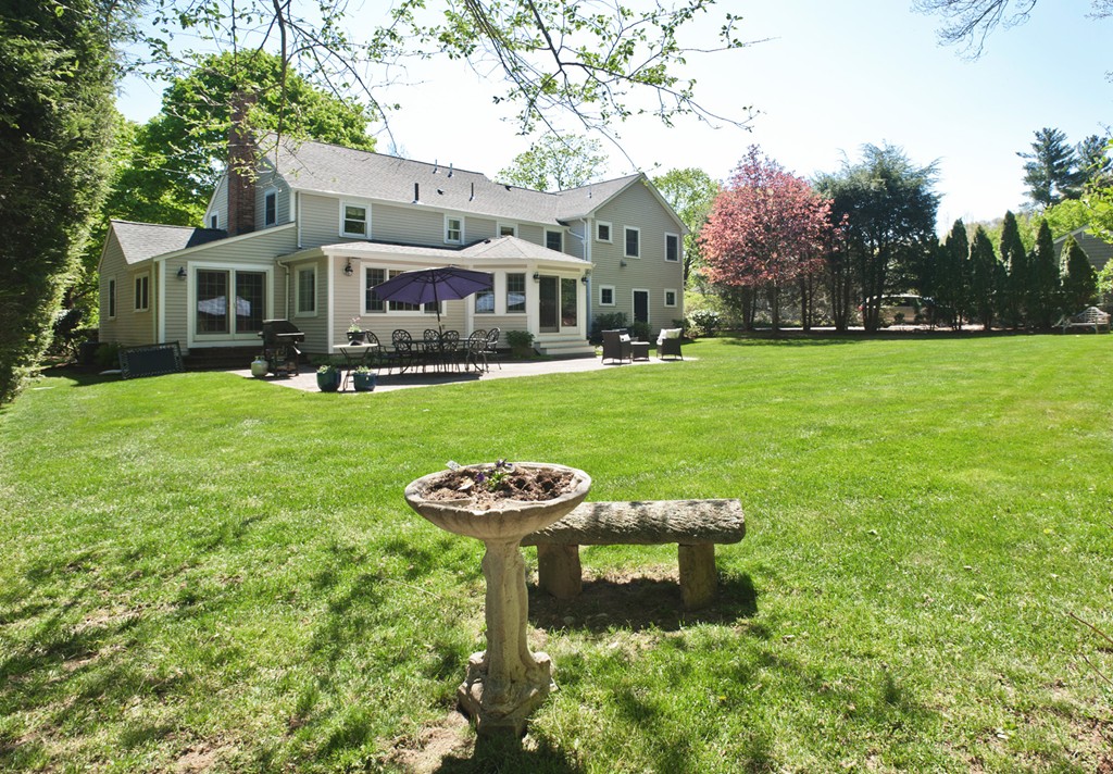 15 Jackson Road Wellesley, MA 02481 - Photo 27 of 27 a front view of a house with garden and trees