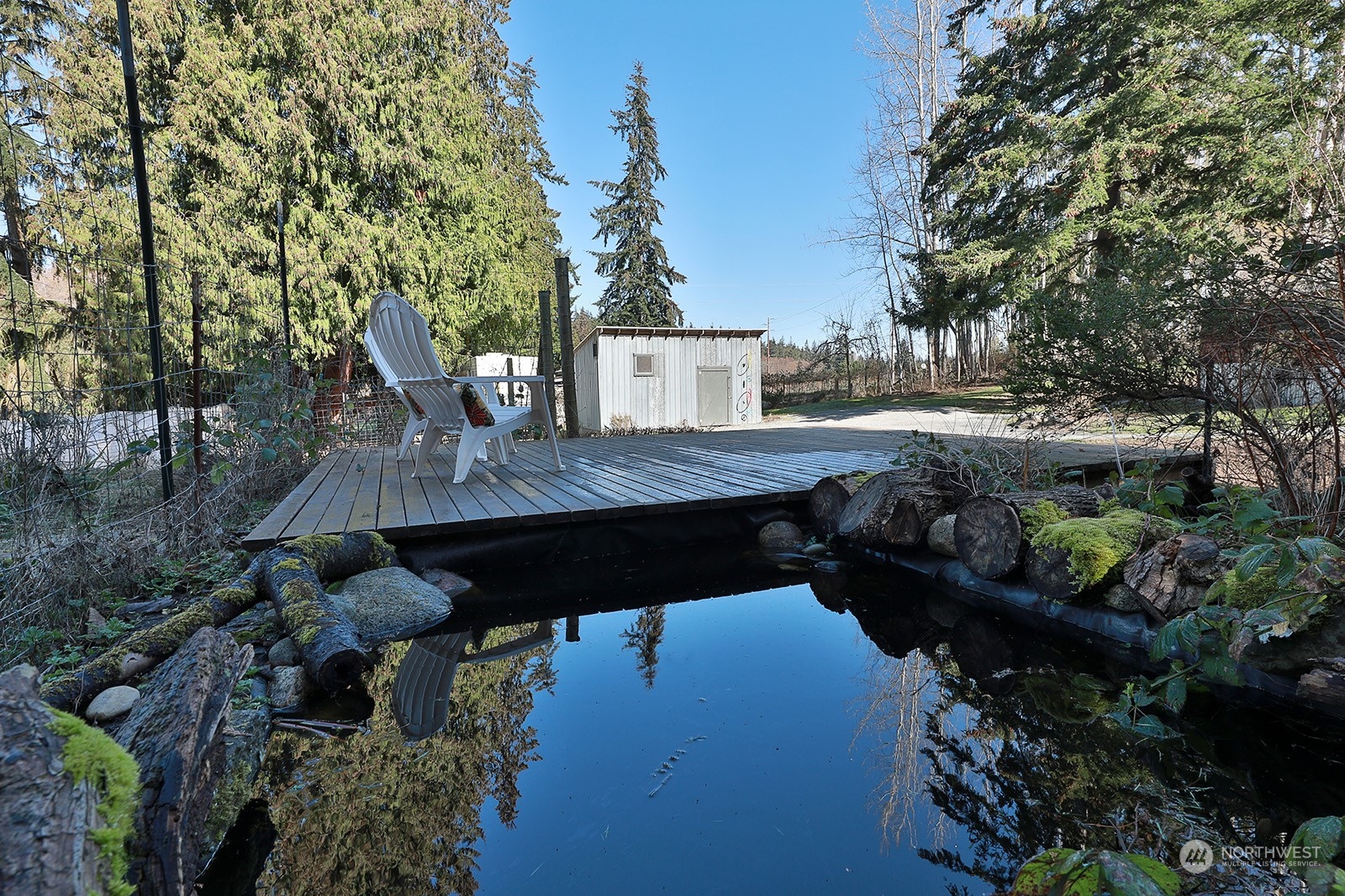 5612 Osprey Road Freeland, WA 98249 - Photo 18 of 29 a view of a house with a backyard