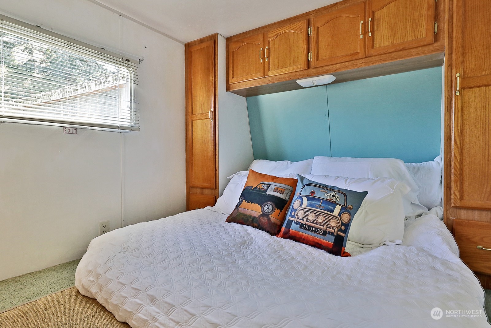 5612 Osprey Road Freeland, WA 98249 - Photo 25 of 29 a bed sitting in a room next to a window