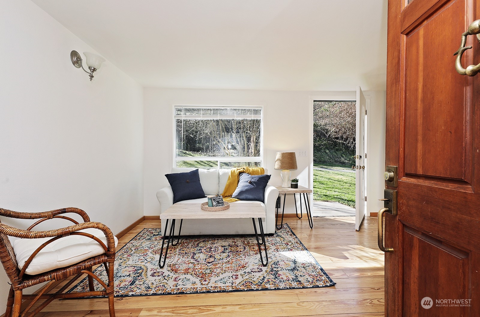 5612 Osprey Road Freeland, WA 98249 - Photo 6 of 29 a living room with furniture and wooden floor