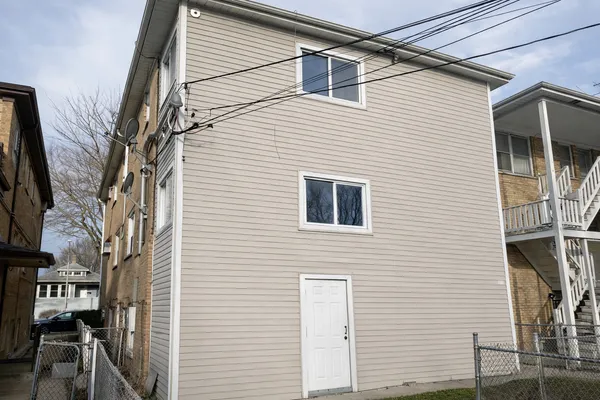 a view of a house with a street