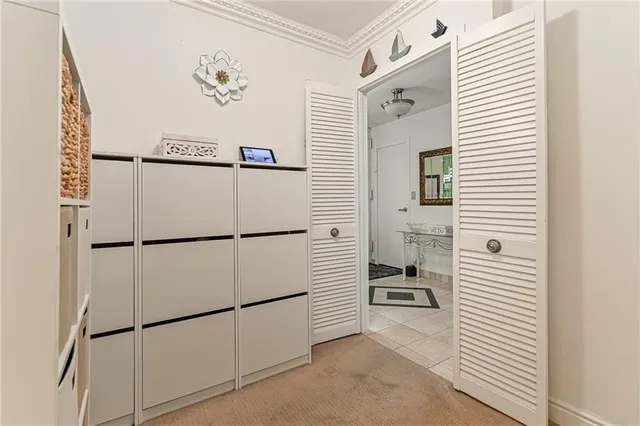 a bathroom with a granite countertop sink a toilet and a mirror