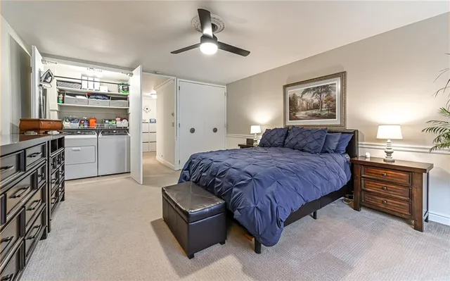 a bedroom with a bed and a sink