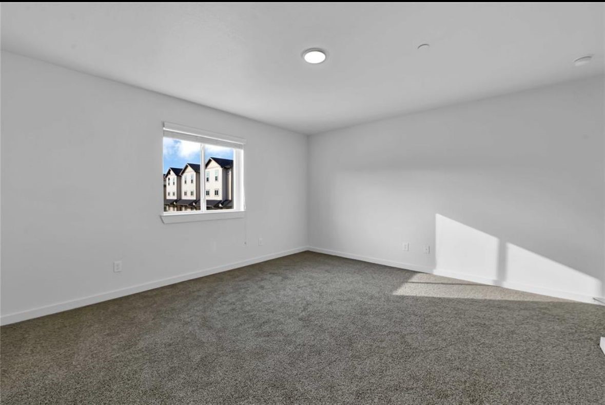 12603 Telge Road, Unit 23E Cypress, TX 77429 - Photo 13 of 25 an empty room with windows