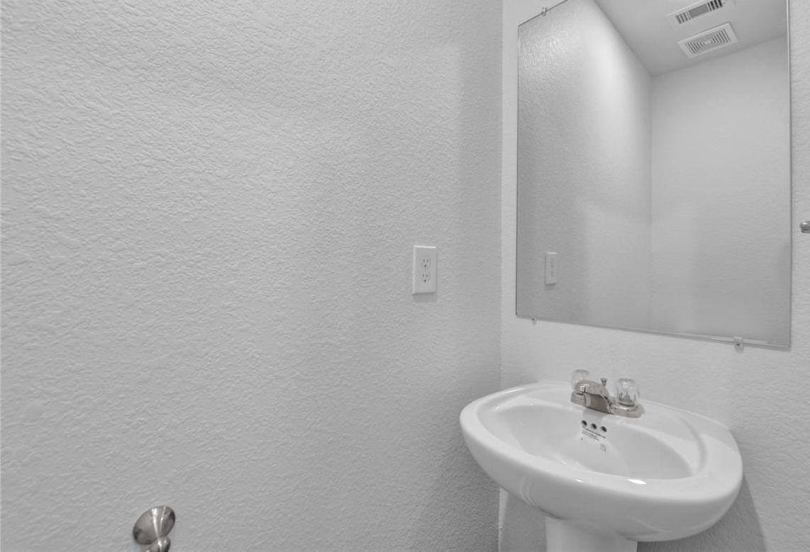 12603 Telge Road, Unit 23E Cypress, TX 77429 - Photo 17 of 25 a bathroom with a sink and a mirror