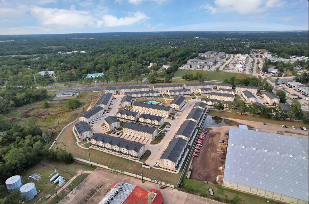 12603 Telge Road, Unit 23E Cypress, TX 77429 - Photo 19 of 25 an aerial view of a city with lots of residential buildings ocean and mountain view in back